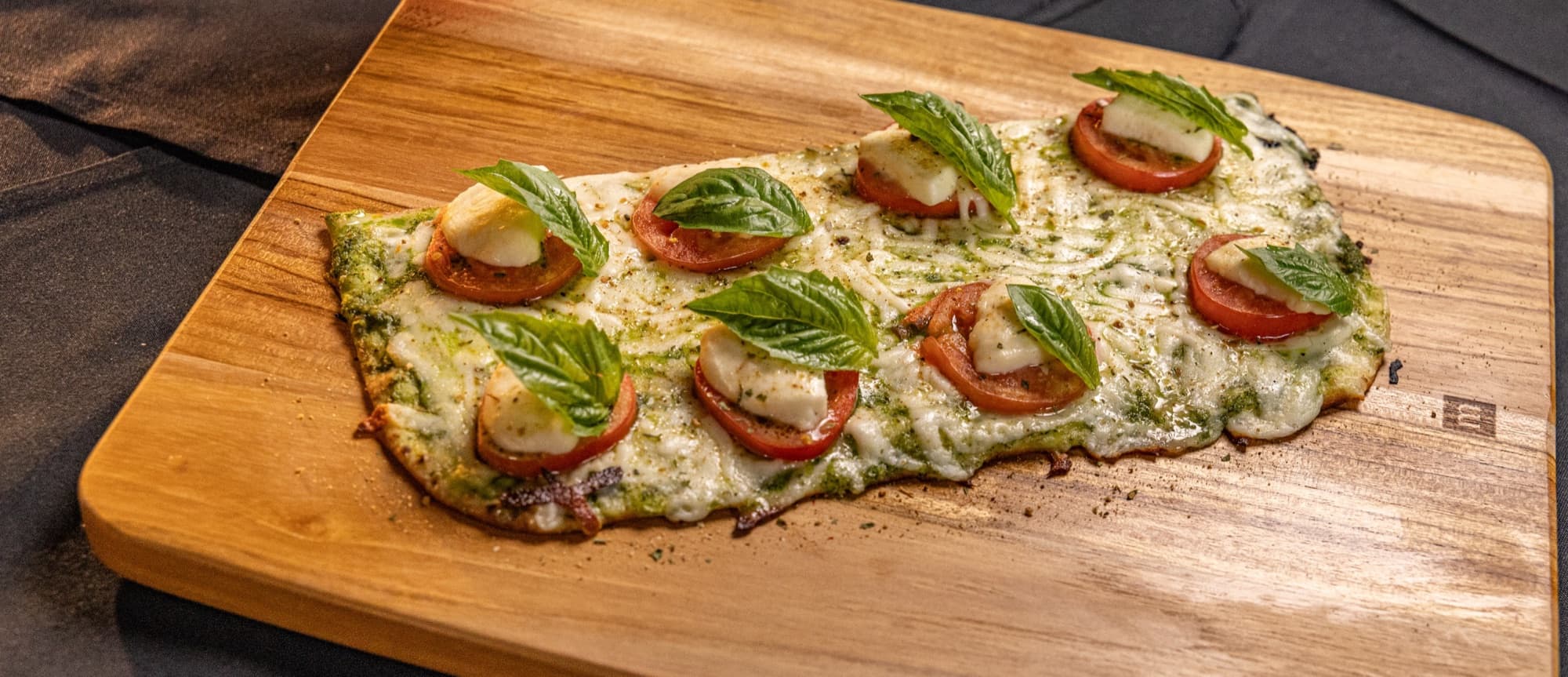 Caprese stone flatbread with tomato and mozzarella